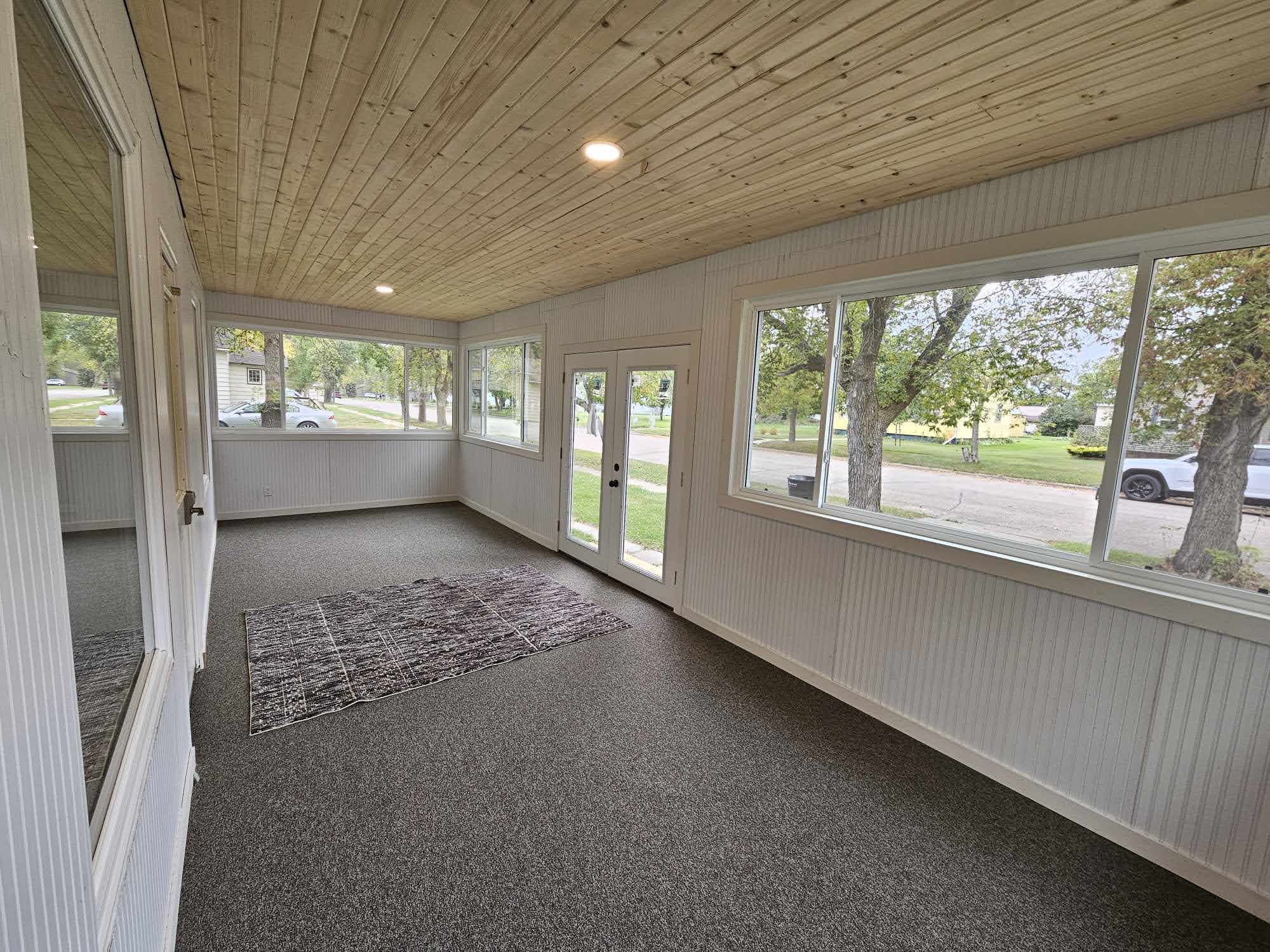Spacious enclosed porch with panoramic windows