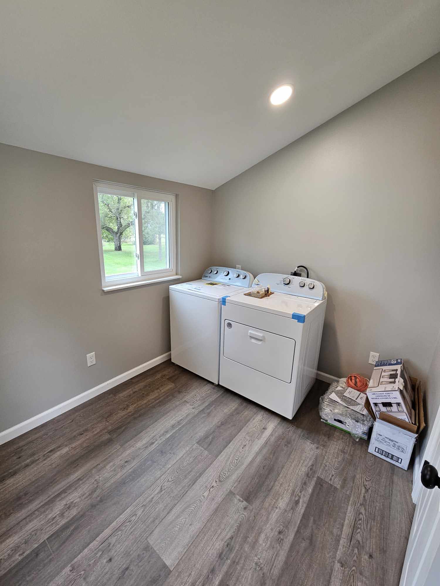 In-home laundry room with washer and dryer
