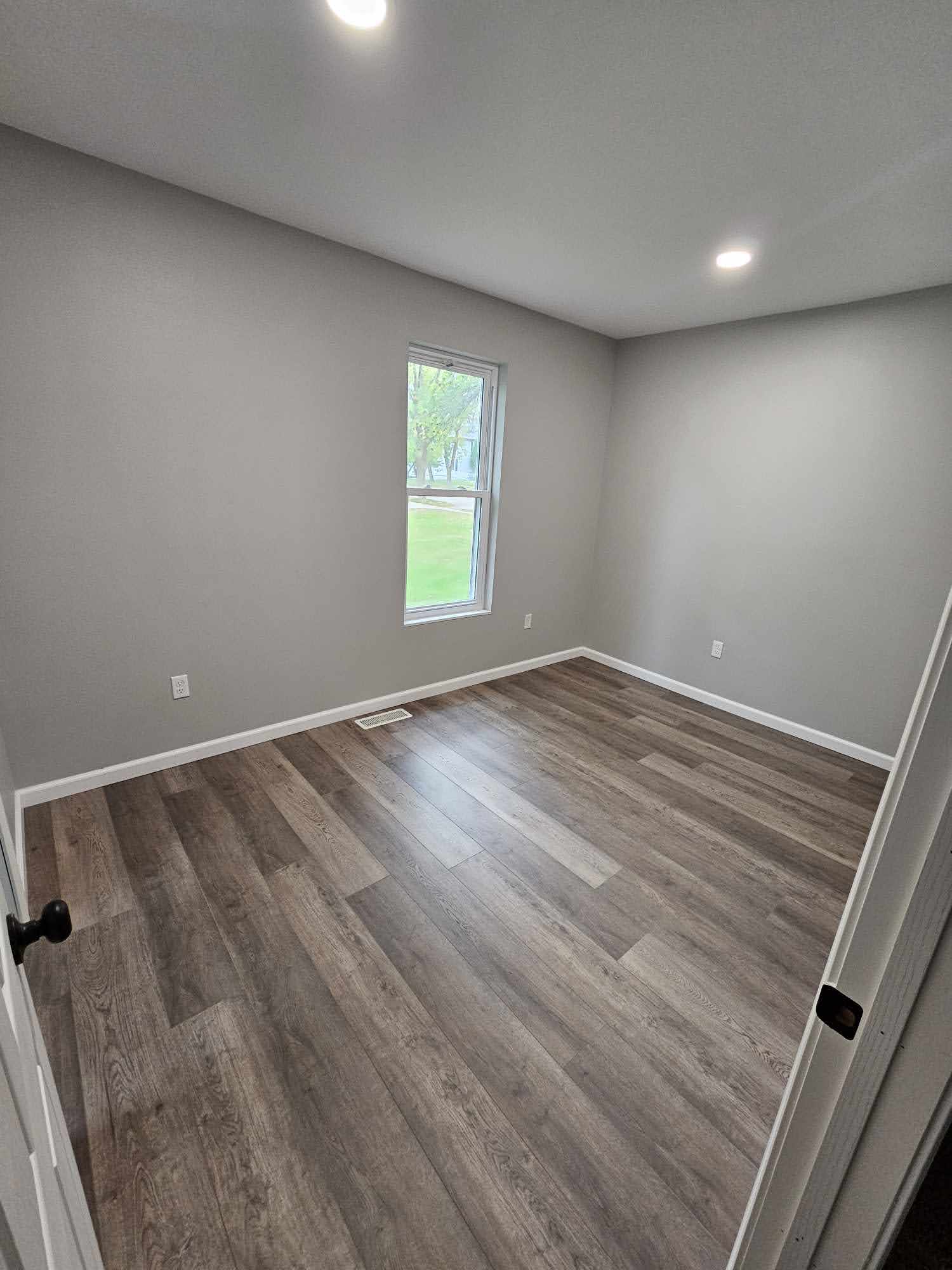Main floor master bedroom with new flooring