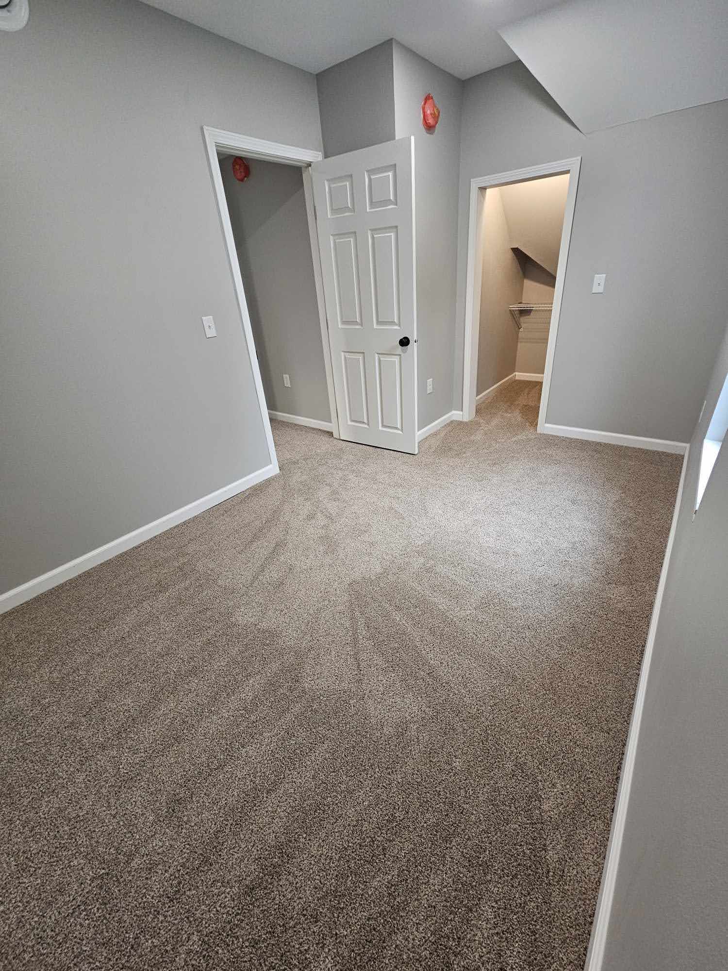 Upstairs bedroom with closet and walk-in storage